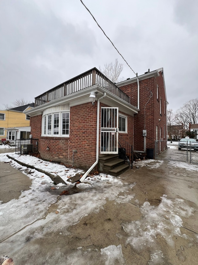 view of snow covered house