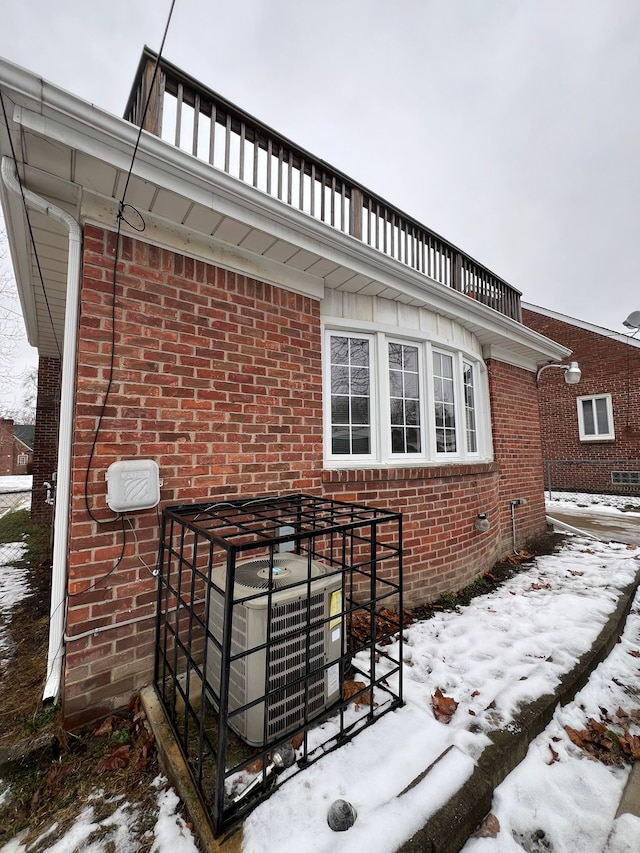 exterior space with central AC and a balcony