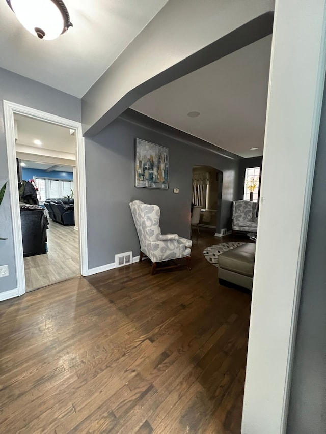 sitting room with hardwood / wood-style flooring