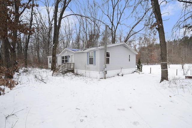 view of snow covered property