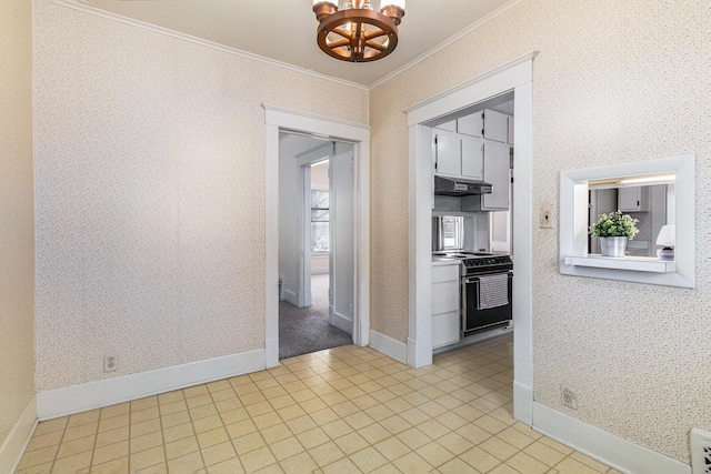 kitchen featuring crown molding, black electric range, and a notable chandelier