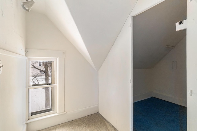 bonus room with carpet and vaulted ceiling