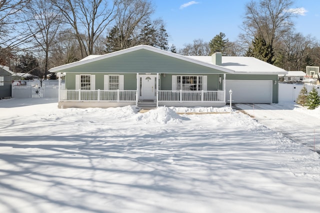 view of front of house with a garage and covered porch