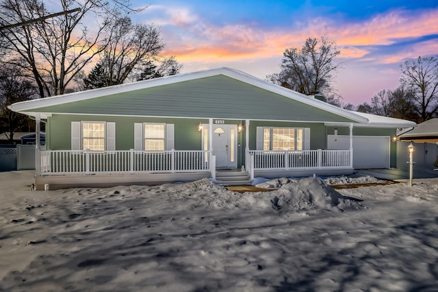 view of front of home featuring a garage and covered porch