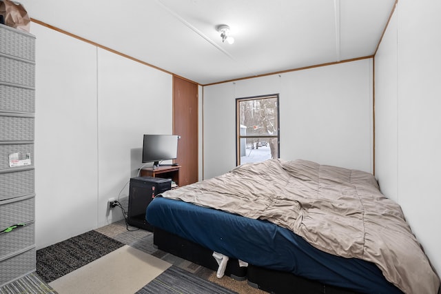 bedroom featuring crown molding