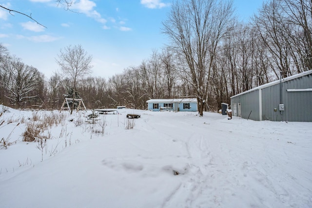 view of yard covered in snow