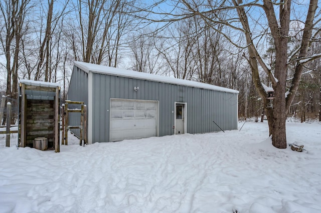 view of snow covered garage