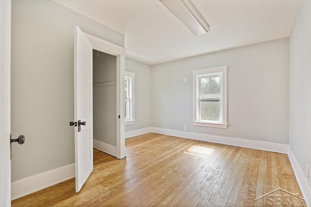 unfurnished room with light hardwood / wood-style flooring