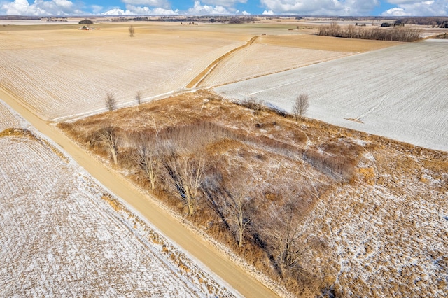 birds eye view of property with a rural view