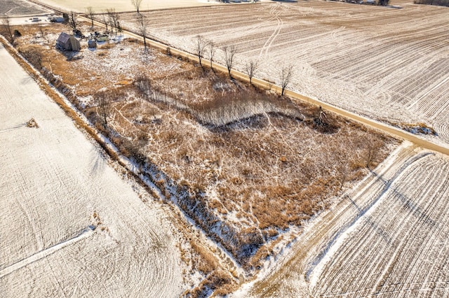 birds eye view of property with a rural view