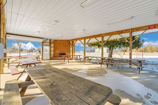 view of patio with a fireplace