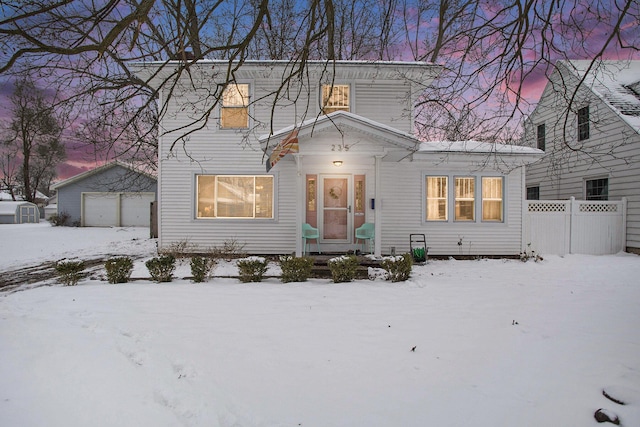 view of front of house with a garage and an outdoor structure