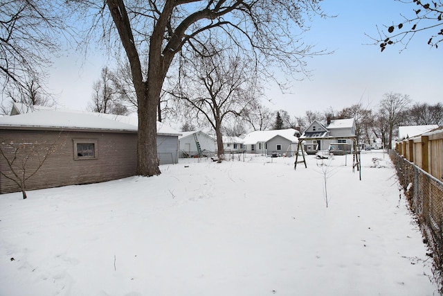 view of yard layered in snow