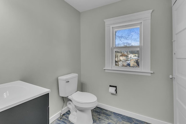 bathroom featuring toilet and vanity