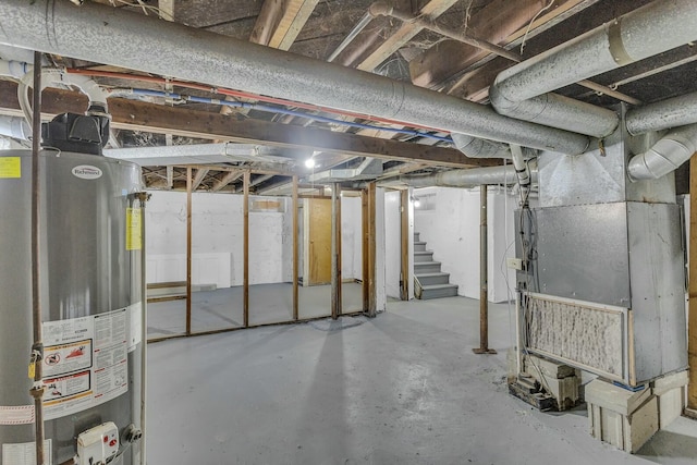 basement featuring heating unit and water heater