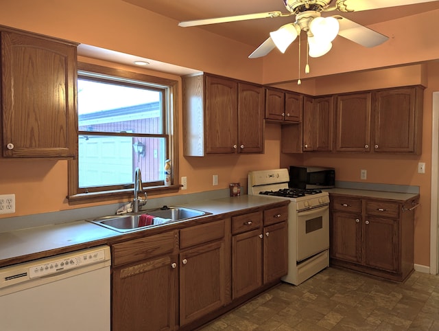 kitchen with ceiling fan, sink, and white appliances