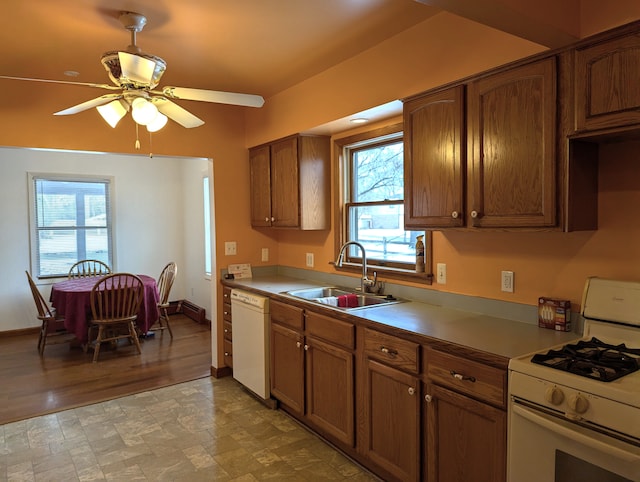 kitchen with sink, white appliances, plenty of natural light, and ceiling fan