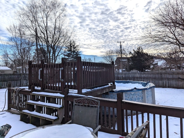 view of snow covered deck