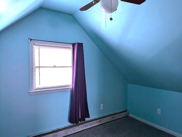 additional living space featuring vaulted ceiling, carpet flooring, ceiling fan, and baseboard heating