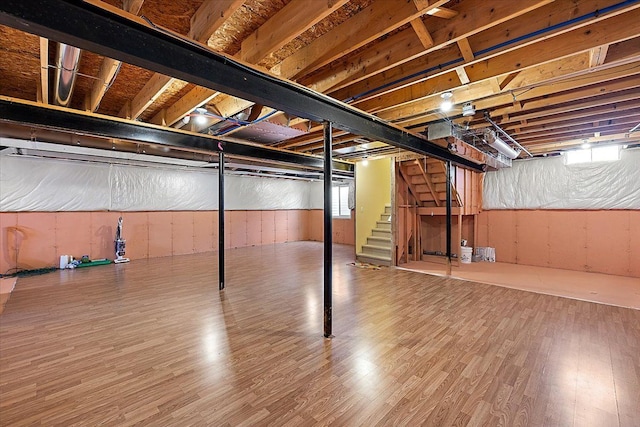 basement featuring wood-type flooring