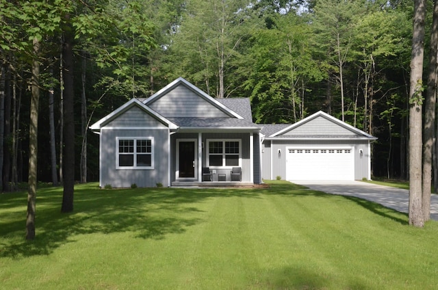 view of front facade with a front lawn, a porch, and a garage