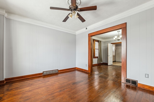 spare room featuring baseboards, crown molding, visible vents, and dark wood-type flooring