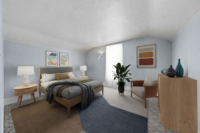 carpeted bedroom with a textured ceiling and lofted ceiling