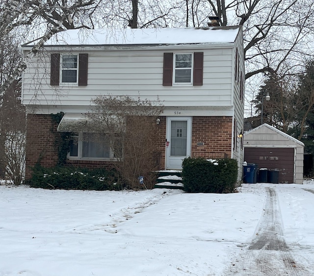 view of front of home featuring a garage and an outdoor structure