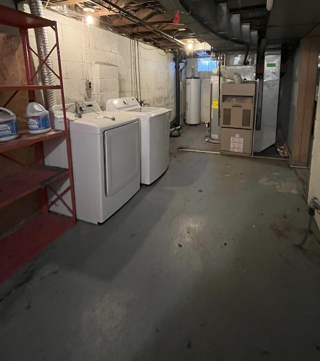 basement with separate washer and dryer, heating unit, and gas water heater