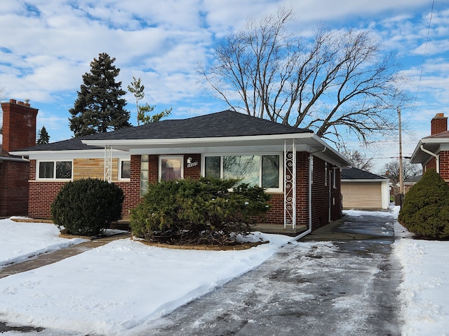 bungalow-style home with a garage