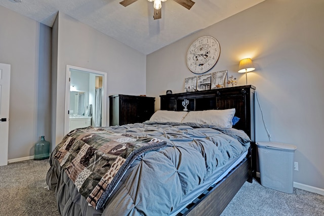 bedroom with ensuite bath, ceiling fan, carpet, and lofted ceiling