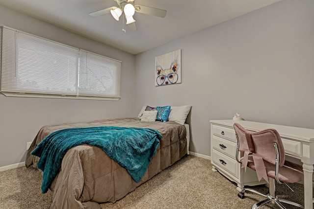 bedroom with ceiling fan and light carpet