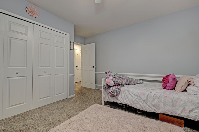 carpeted bedroom featuring a closet