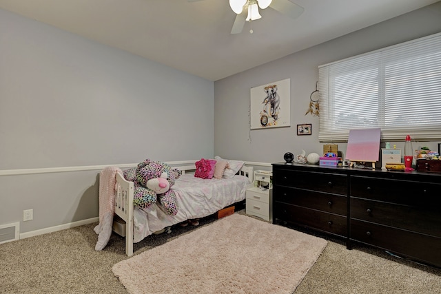 bedroom featuring ceiling fan and light carpet