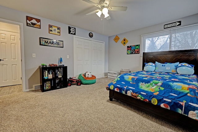 bedroom featuring ceiling fan, carpet flooring, and a closet