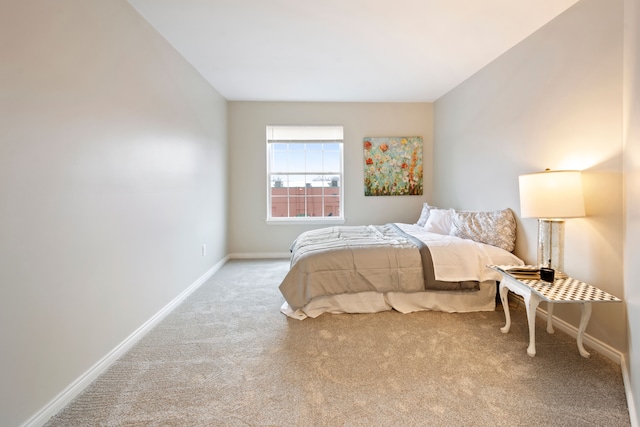 bedroom with light colored carpet