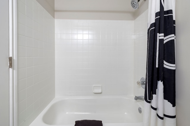 bathroom with shower / tub combo with curtain