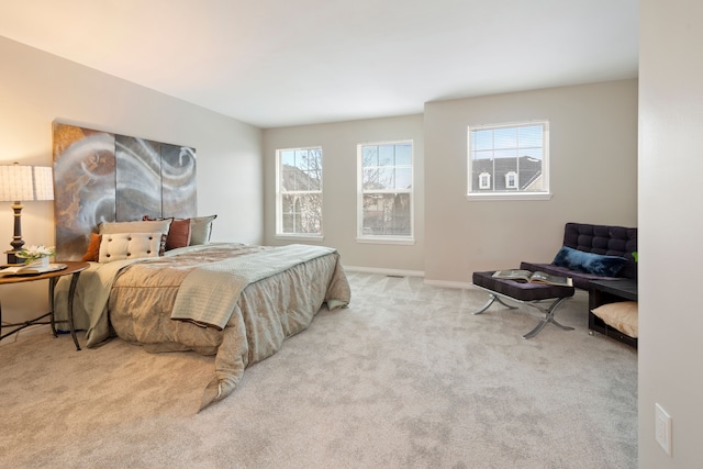 bedroom featuring light carpet