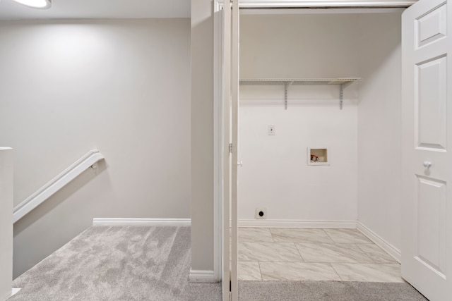 laundry room featuring light carpet and washer hookup