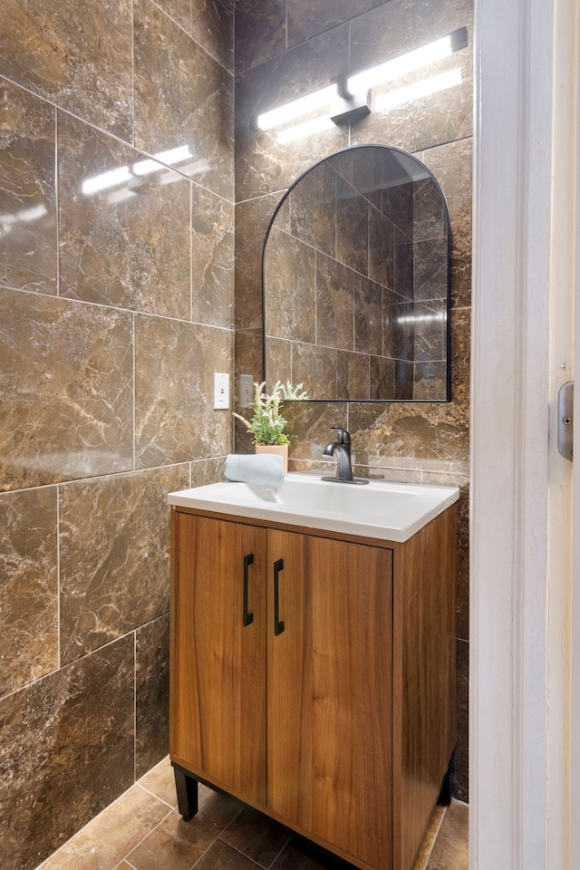 bathroom featuring tile walls and vanity