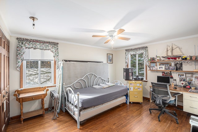 bedroom featuring a closet, ceiling fan, hardwood / wood-style floors, and crown molding