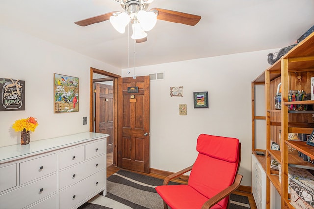 living area with ceiling fan