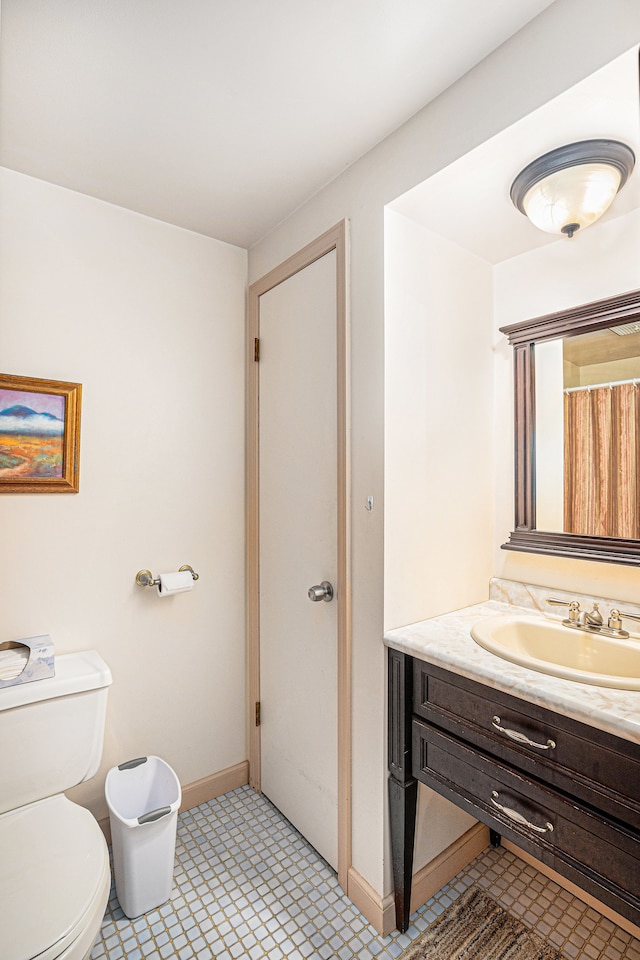 bathroom with toilet and vanity