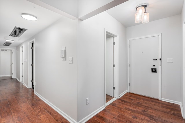 foyer entrance with dark wood-type flooring