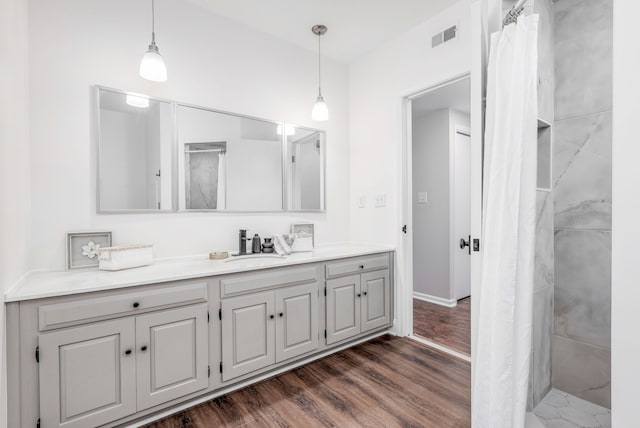 bathroom featuring hardwood / wood-style floors and vanity