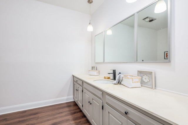 bathroom with wood-type flooring and vanity