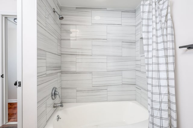 bathroom with shower / tub combo with curtain