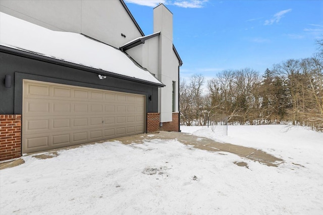 view of snow covered garage