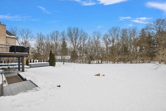 view of yard covered in snow