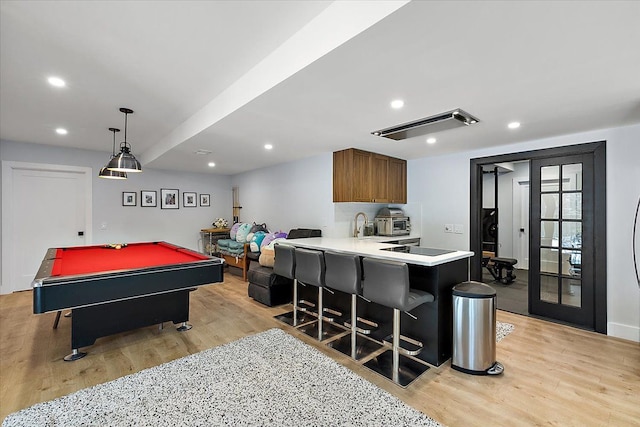 recreation room with recessed lighting, pool table, and light wood-style flooring